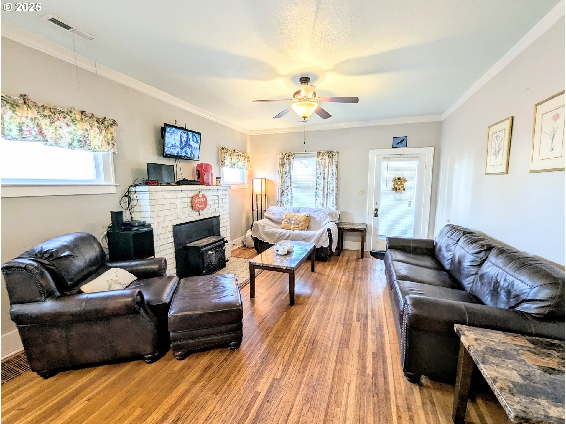 1302 9th Street La Grande, OR 97850 - Photo 3 of 15 a living room with furniture and a wooden floor