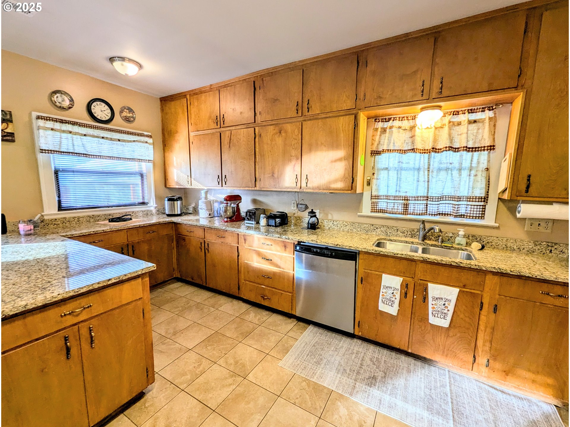 1302 9th Street La Grande, OR 97850 - Photo 9 of 15 a kitchen with stainless steel appliances granite countertop sink stove and cabinets