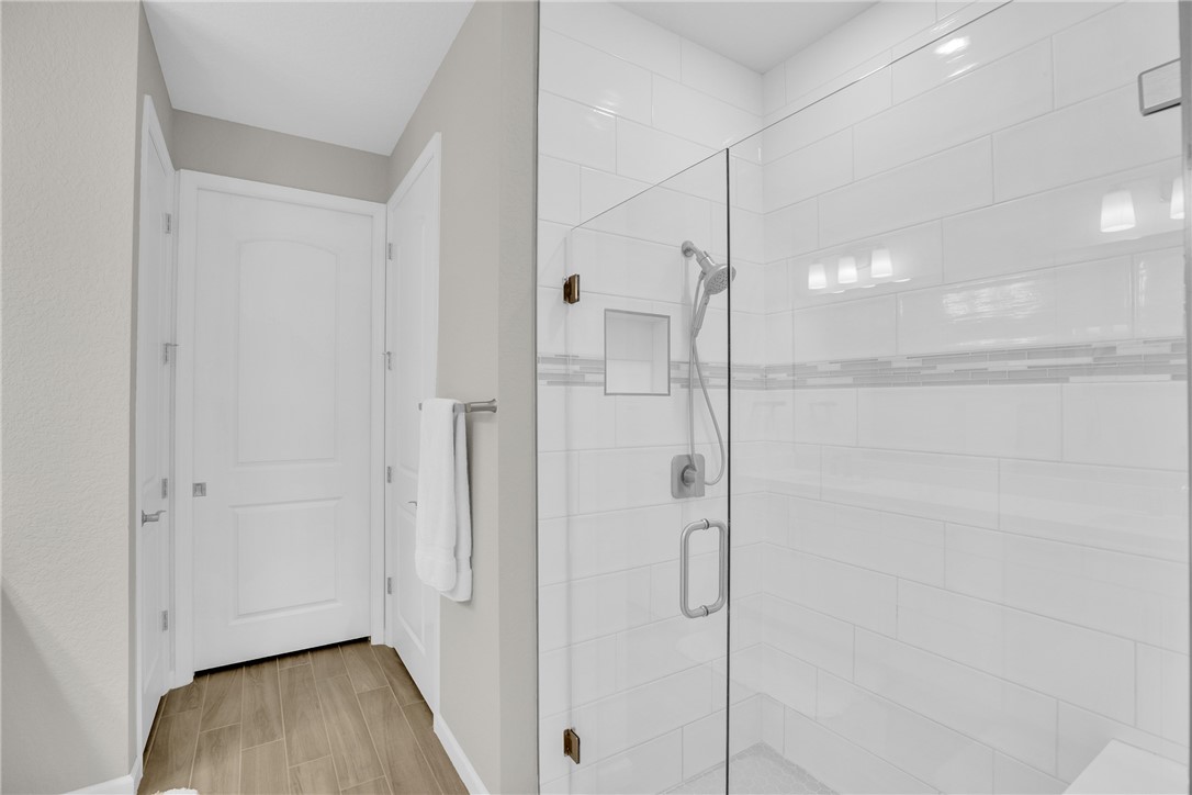 5292 Unity Square Vero Beach, FL 32967 - Photo 18 of 36 a bathroom with a glass shower door