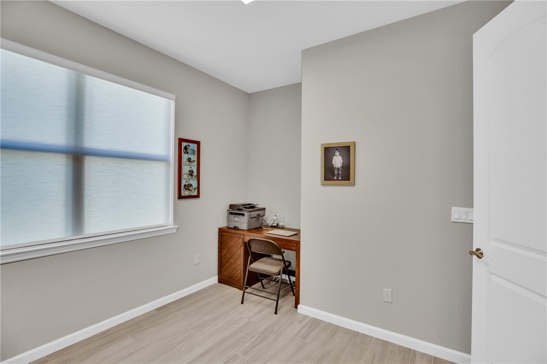 5292 Unity Square Vero Beach, FL 32967 - Photo 23 of 36 a workspace with wooden floor and a window