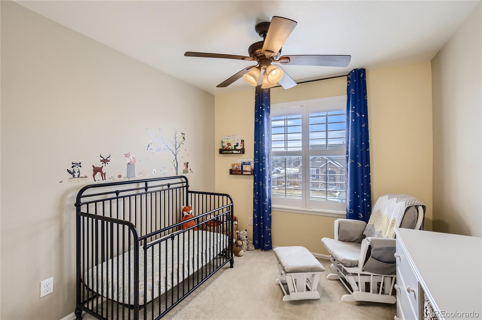 8314 Raspberry Drive Frederick, CO 80504 - Photo 20 of 31 a bedroom with a bed and window