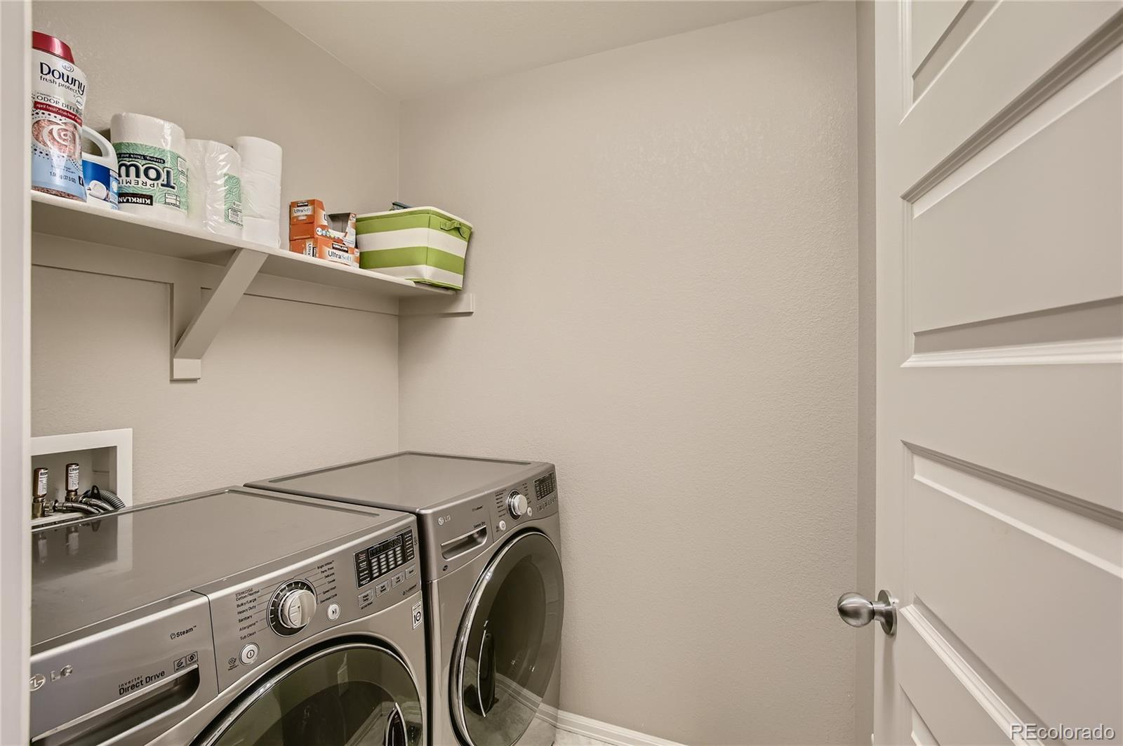 8314 Raspberry Drive Frederick, CO 80504 - Photo 23 of 31 a utility room with dryer and washer
