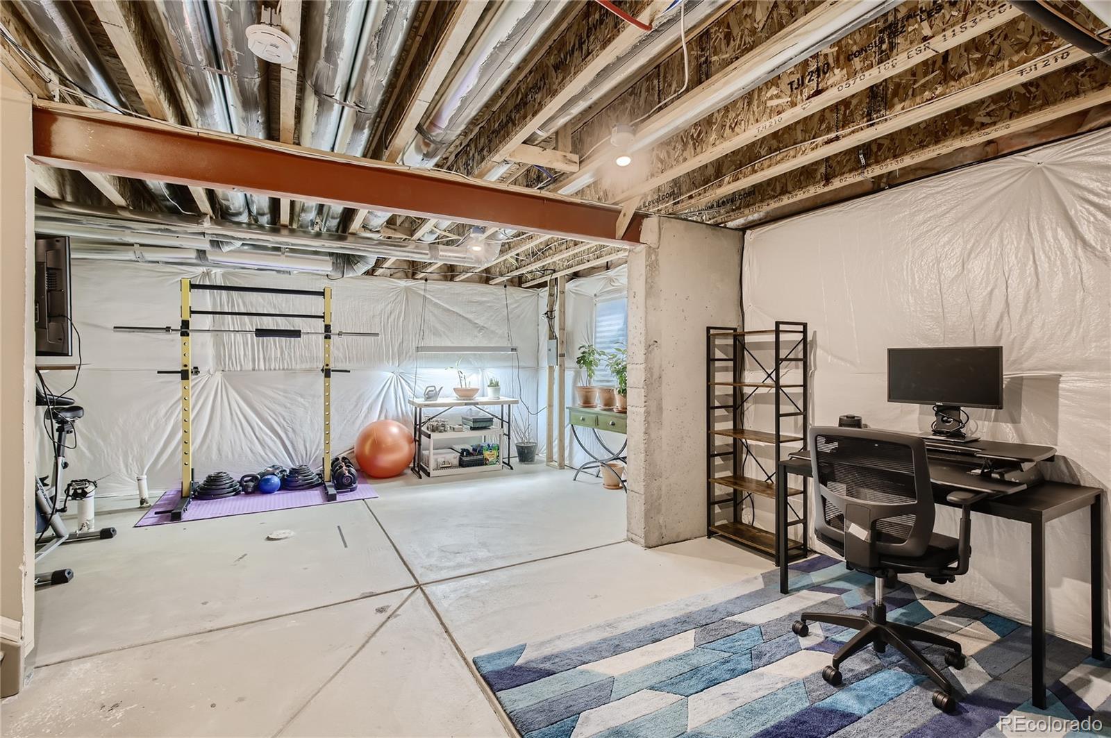 8314 Raspberry Drive Frederick, CO 80504 - Photo 24 of 31 a view of a room with gym equipment