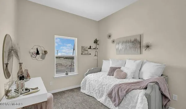 a bed room with a bed and a window