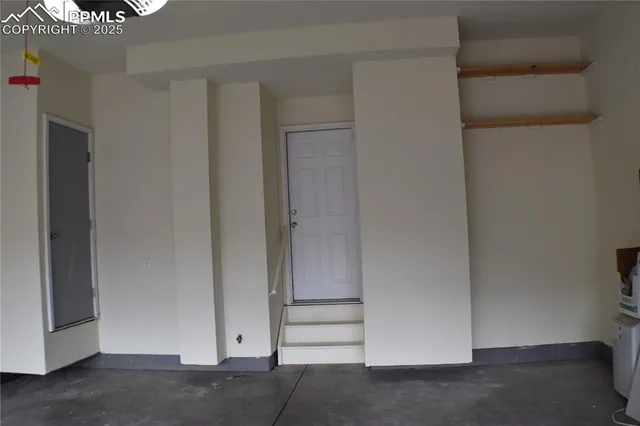 a black and white building with a large window and large window