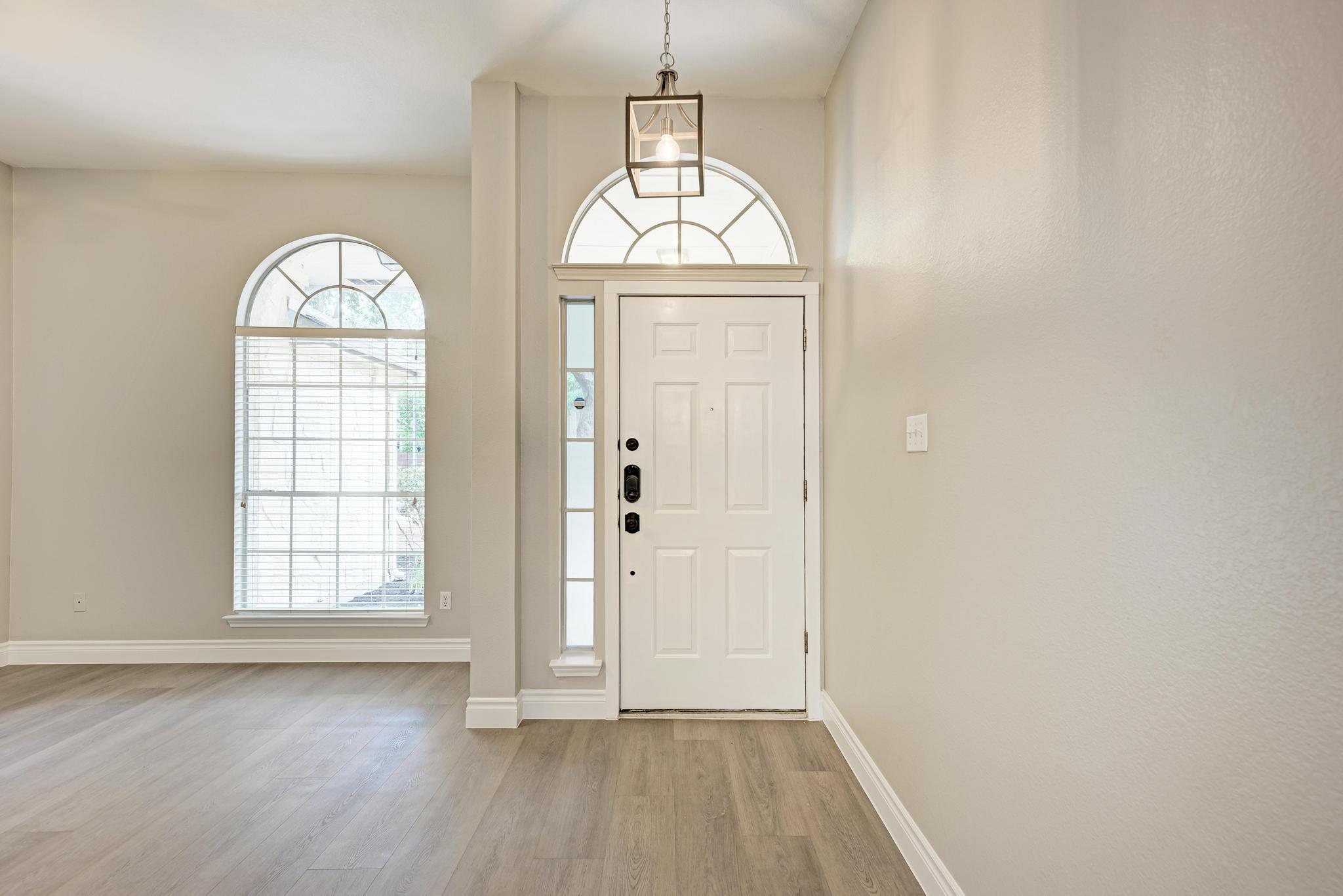 4408 Tello Path Austin, TX 78749 - Photo 3 of 38 Foyer featuring light wood-type flooring and baseboards