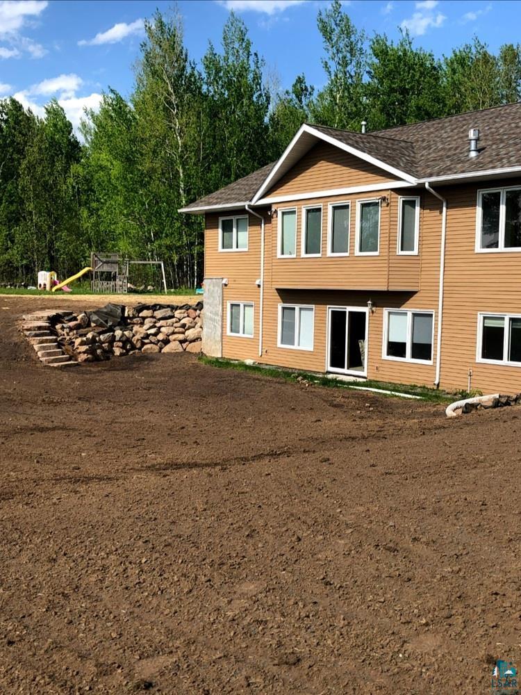 5721 Taft Road Duluth, MN 55803 - Photo 49 of 50 Yard reseeded with erosion control mats & grass has grown in.
