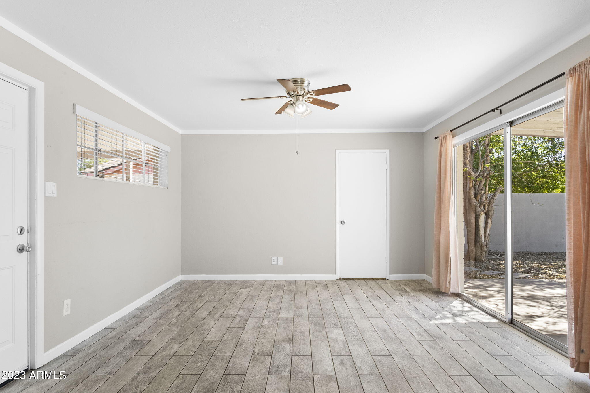 2525 West Freeway Lane Phoenix, AZ 85021 - Photo 14 of 41 wooden floor in an empty room with a window