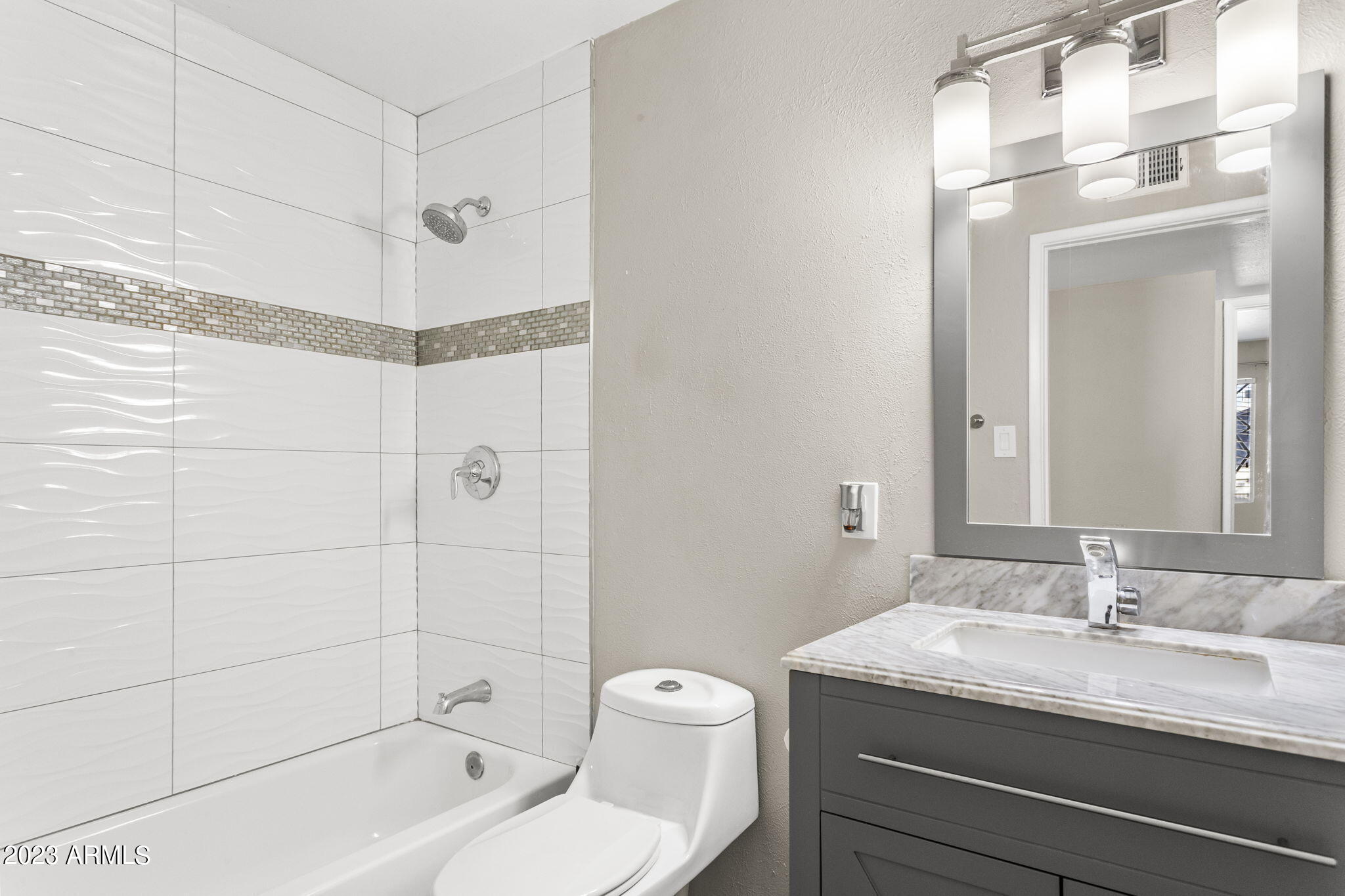 2525 West Freeway Lane Phoenix, AZ 85021 - Photo 15 of 41 a bathroom with a granite countertop sink a toilet and shower