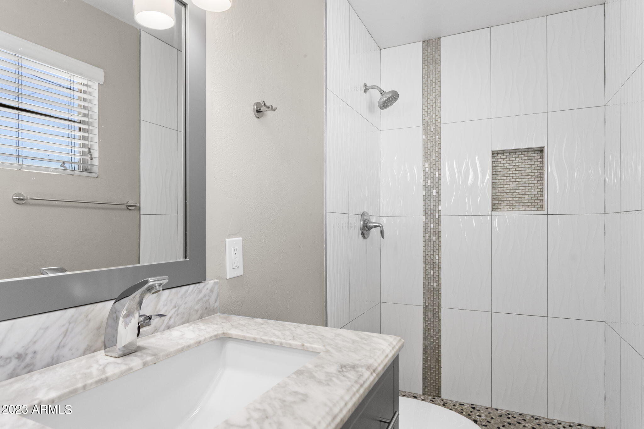 2525 West Freeway Lane Phoenix, AZ 85021 - Photo 19 of 41 a bathroom with a granite countertop sink and a mirror