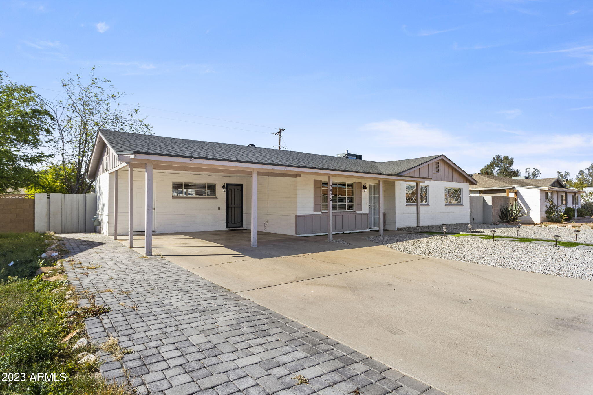 2525 West Freeway Lane Phoenix, AZ 85021 - Photo 2 of 41 a front view of a house with a yard and garage