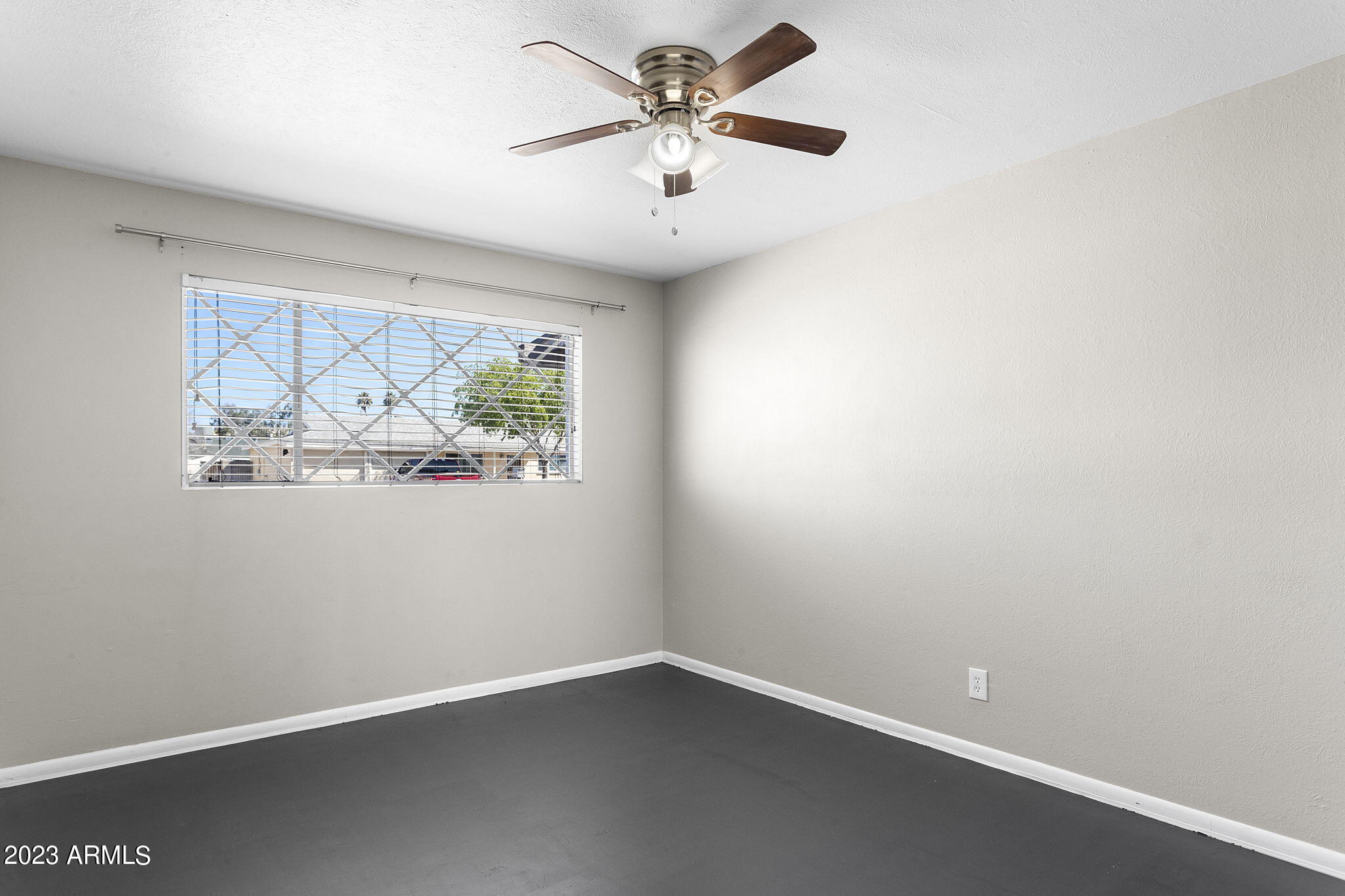 2525 West Freeway Lane Phoenix, AZ 85021 - Photo 24 of 41 an empty room with a window and a fan
