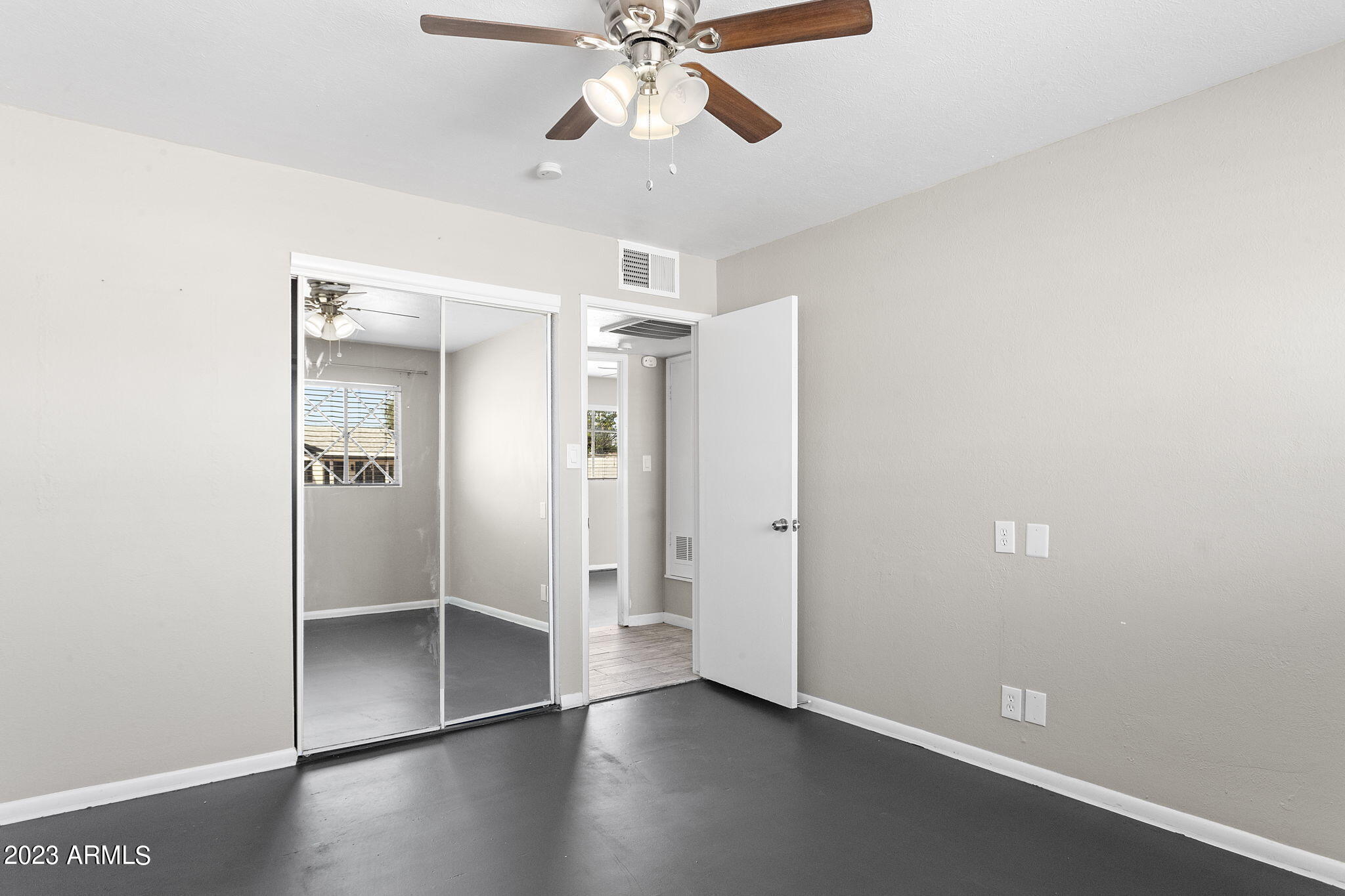 2525 West Freeway Lane Phoenix, AZ 85021 - Photo 26 of 41 wooden floor in an empty room with a window
