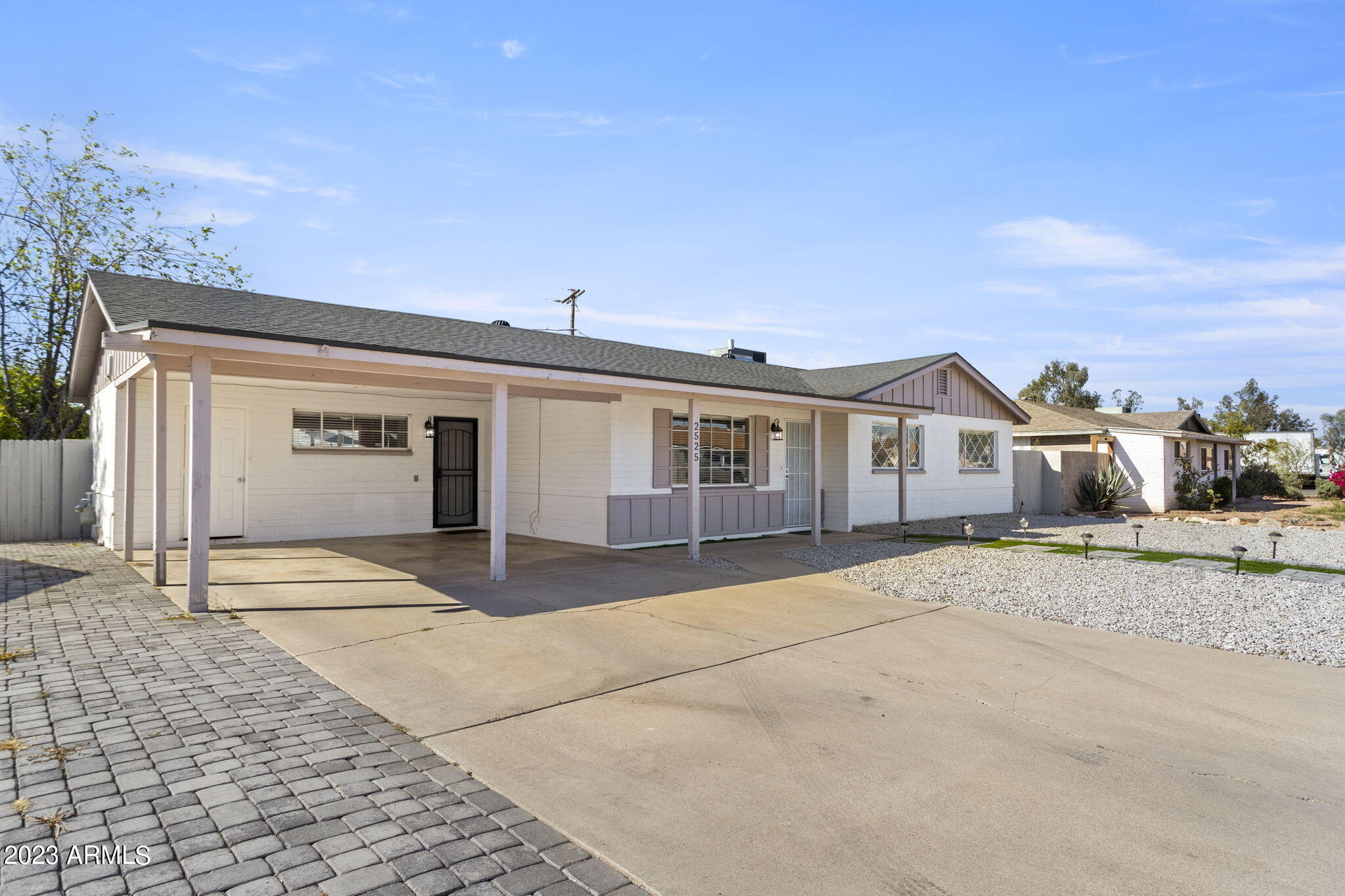 2525 West Freeway Lane Phoenix, AZ 85021 - Photo 3 of 41 a front view of a house with a yard and garage