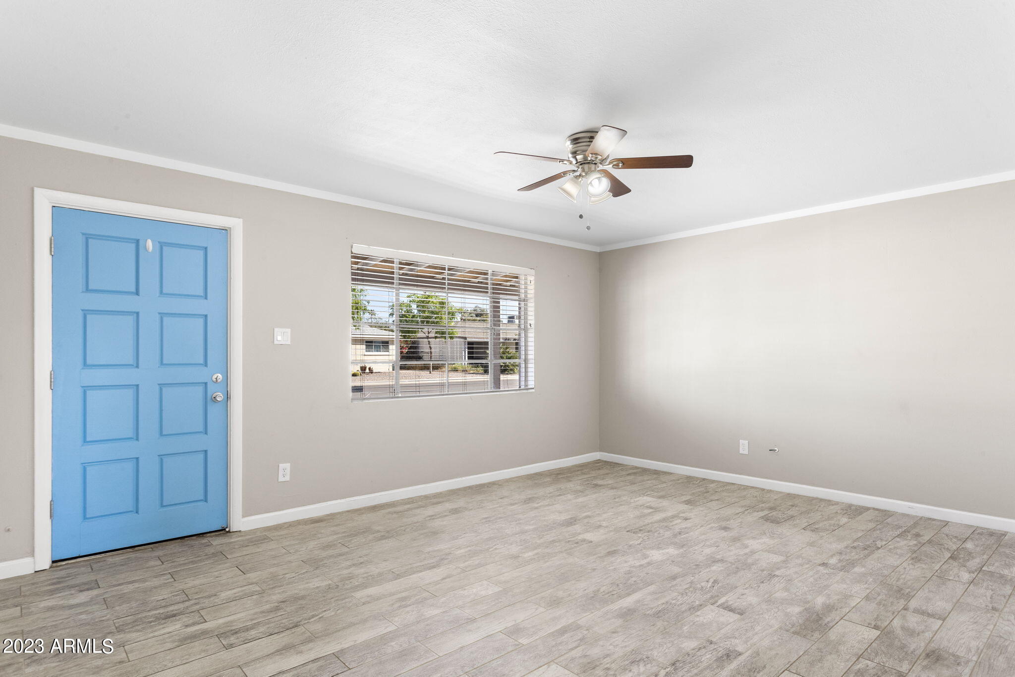 2525 West Freeway Lane Phoenix, AZ 85021 - Photo 4 of 41 a view of room with a ceiling fan and hardwood floor