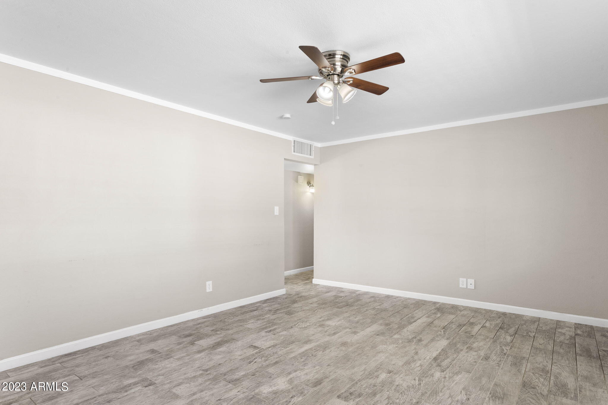 2525 West Freeway Lane Phoenix, AZ 85021 - Photo 5 of 41 an empty room with closet and fan