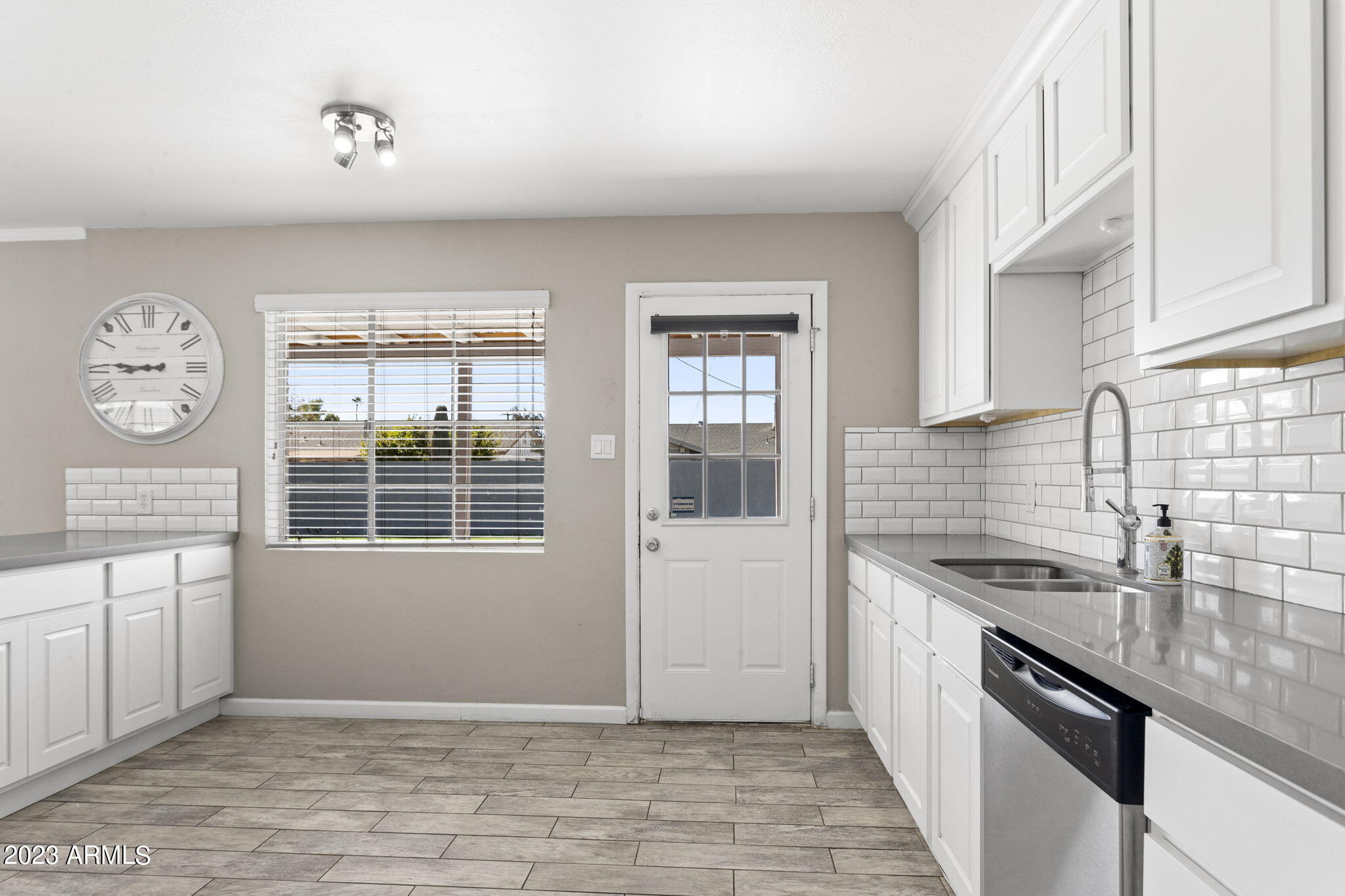 2525 West Freeway Lane Phoenix, AZ 85021 - Photo 9 of 41 a kitchen with granite countertop a sink a stove and cabinets