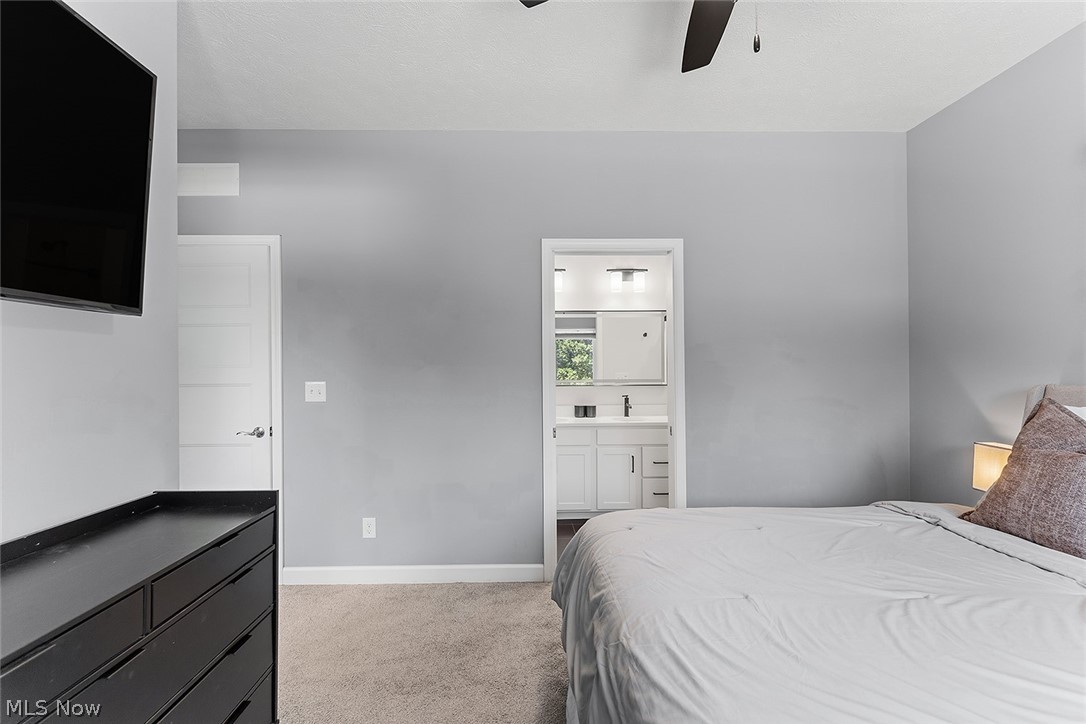 2308 Fulton Road Cleveland, OH 44113 - Photo 19 of 30 Bedroom with light gray walls and plush carpet flooring