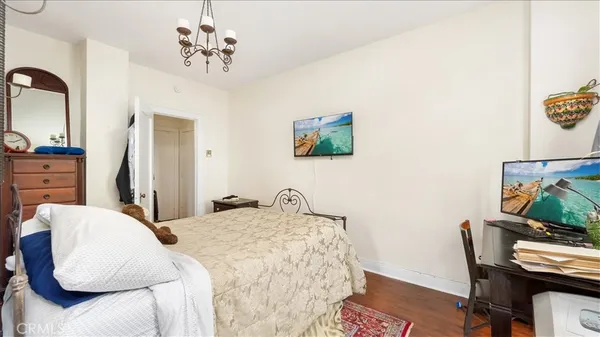 a bedroom with a bed and a chair
