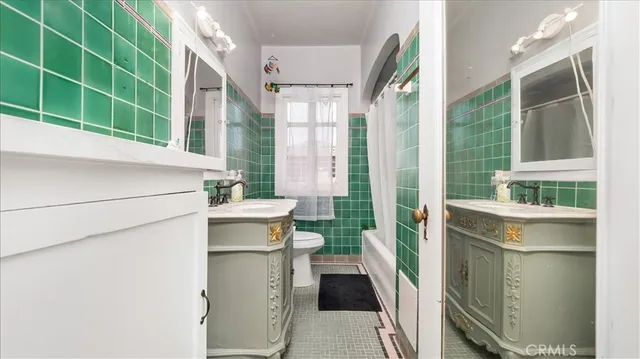 a kitchen with a sink and a refrigerator