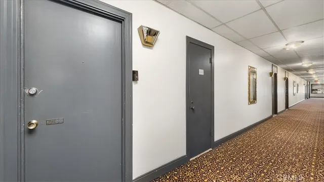 a view of a hallway with a white walls