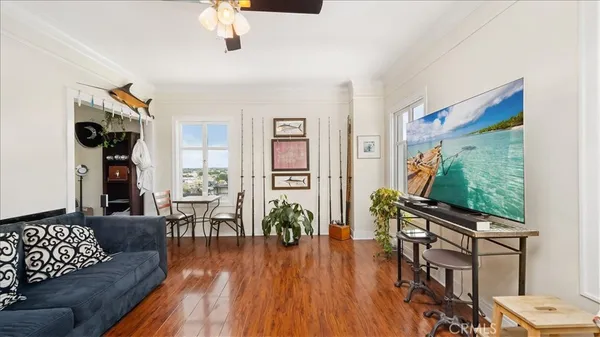 a living room with furniture and a flat screen tv
