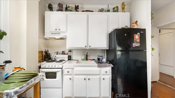 a kitchen with a sink and cabinets