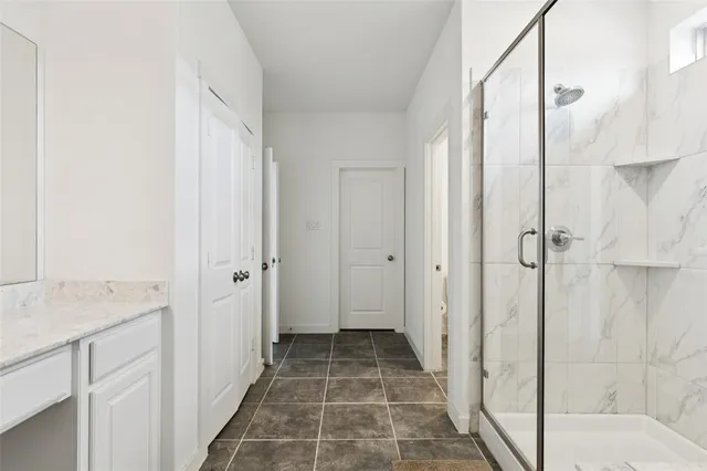 a bathroom with a sink and shower