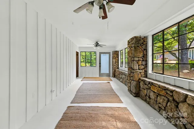 a view of a livingroom with an empty space and a window