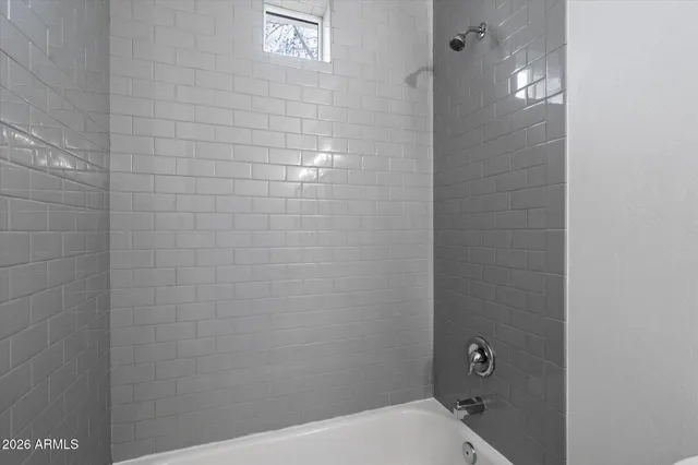 a bathroom with a toilet and shower