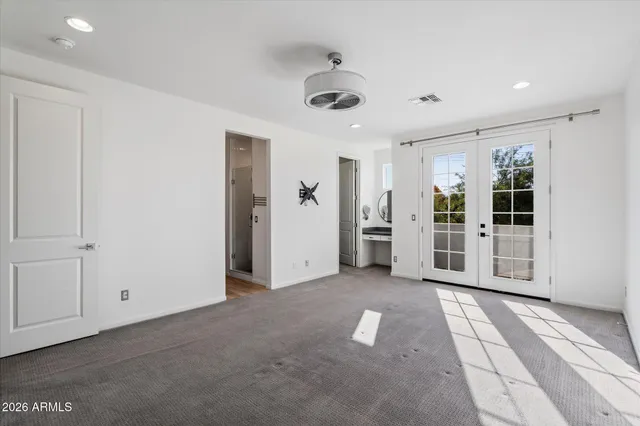 a view of a livingroom with wooden floor and window