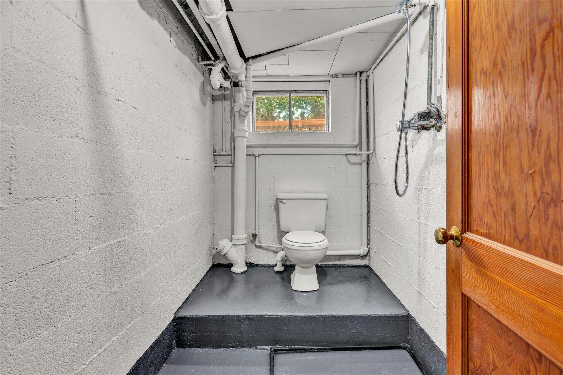 4546 Cowman Road Roanoke, VA 24014 - Photo 23 of 29 a white toilet sitting next to a bathroom sink