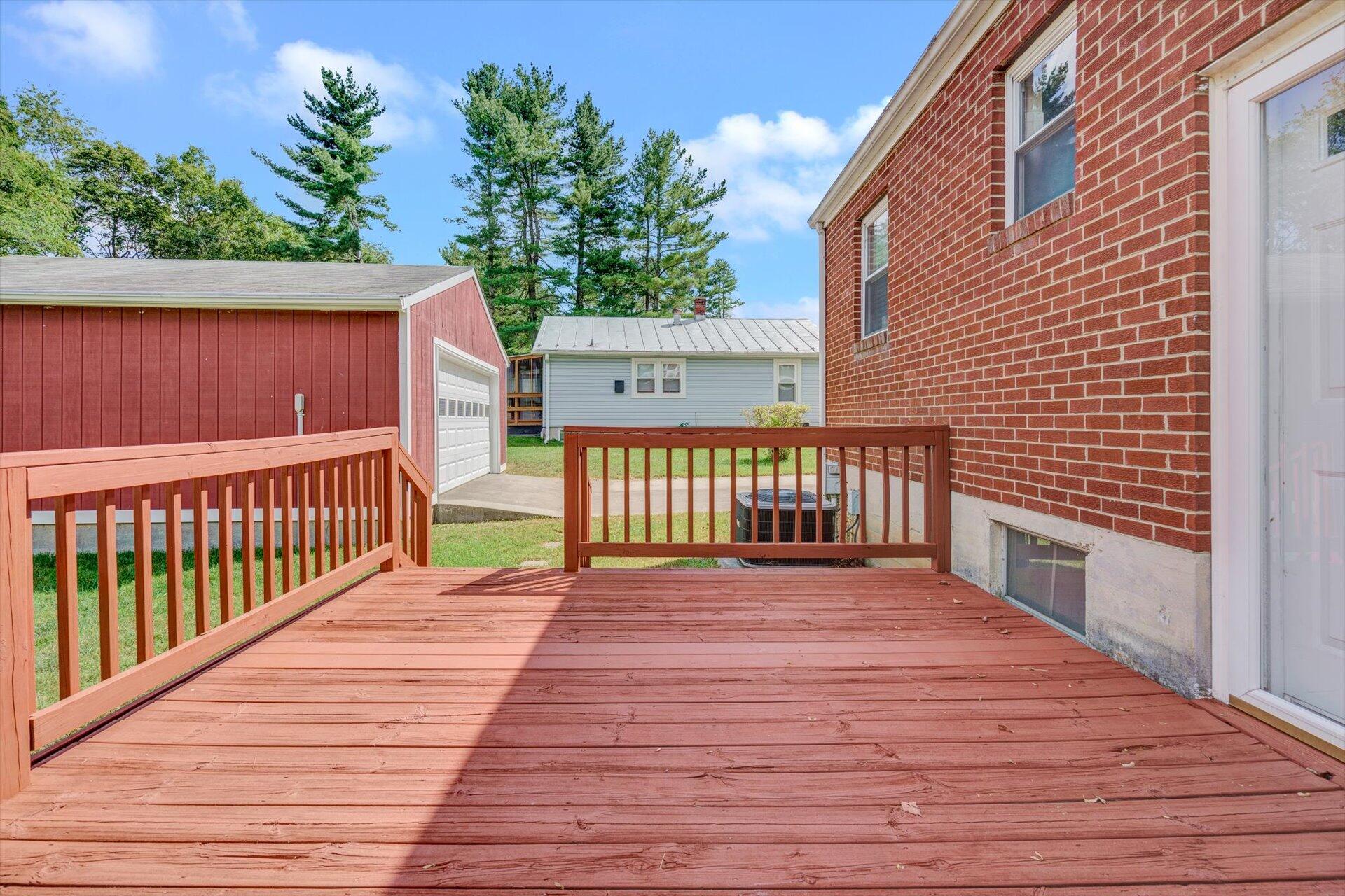 4546 Cowman Road Roanoke, VA 24014 - Photo 25 of 29 a view of a deck with wooden floor and fence with a wooden fence