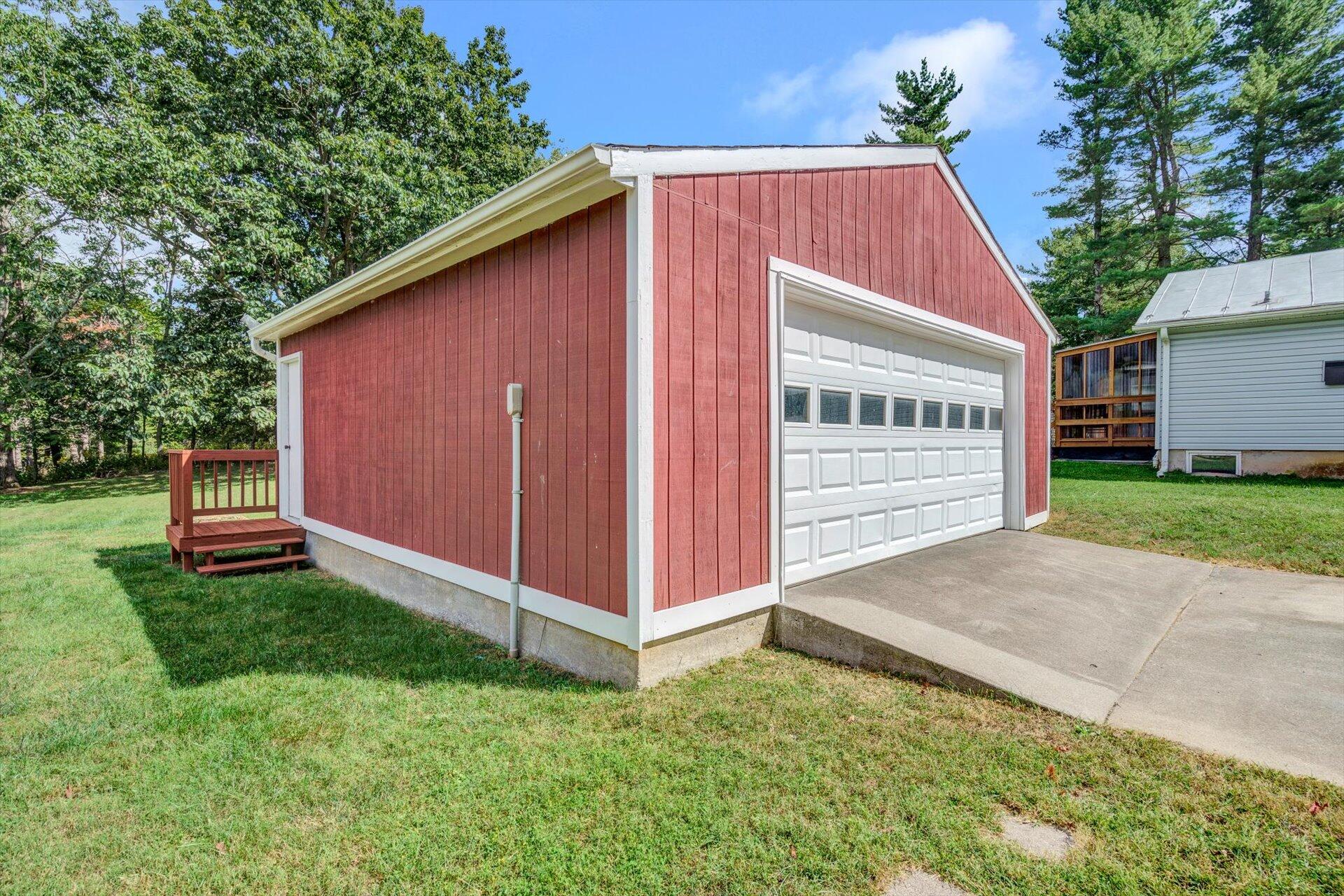 4546 Cowman Road Roanoke, VA 24014 - Photo 28 of 29 a view of backyard with small cabin and wooden fence