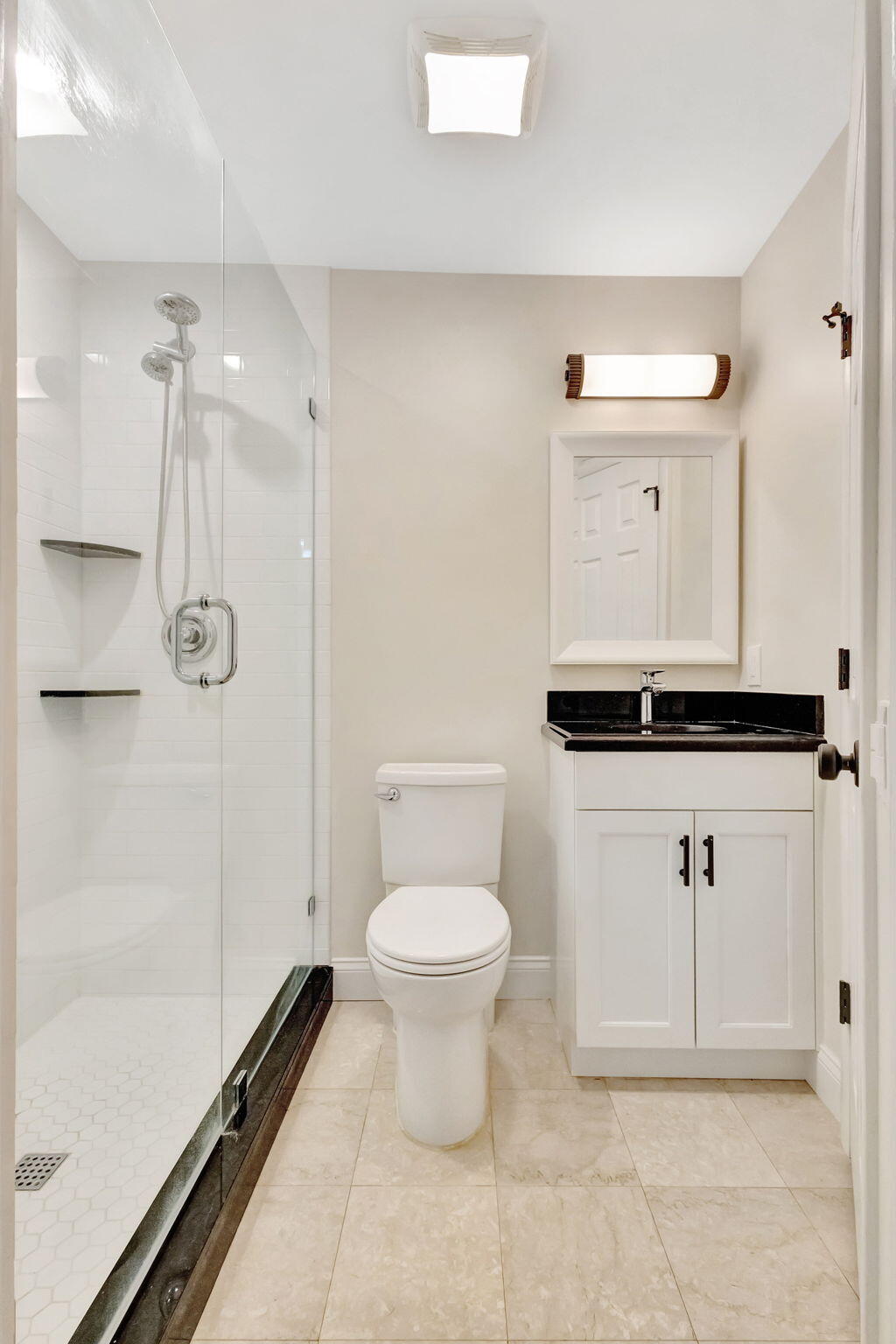 170 Celestial Way, Unit 83 Juno Beach, FL 33408 - Photo 13 of 70 a bathroom with a toilet sink and shower