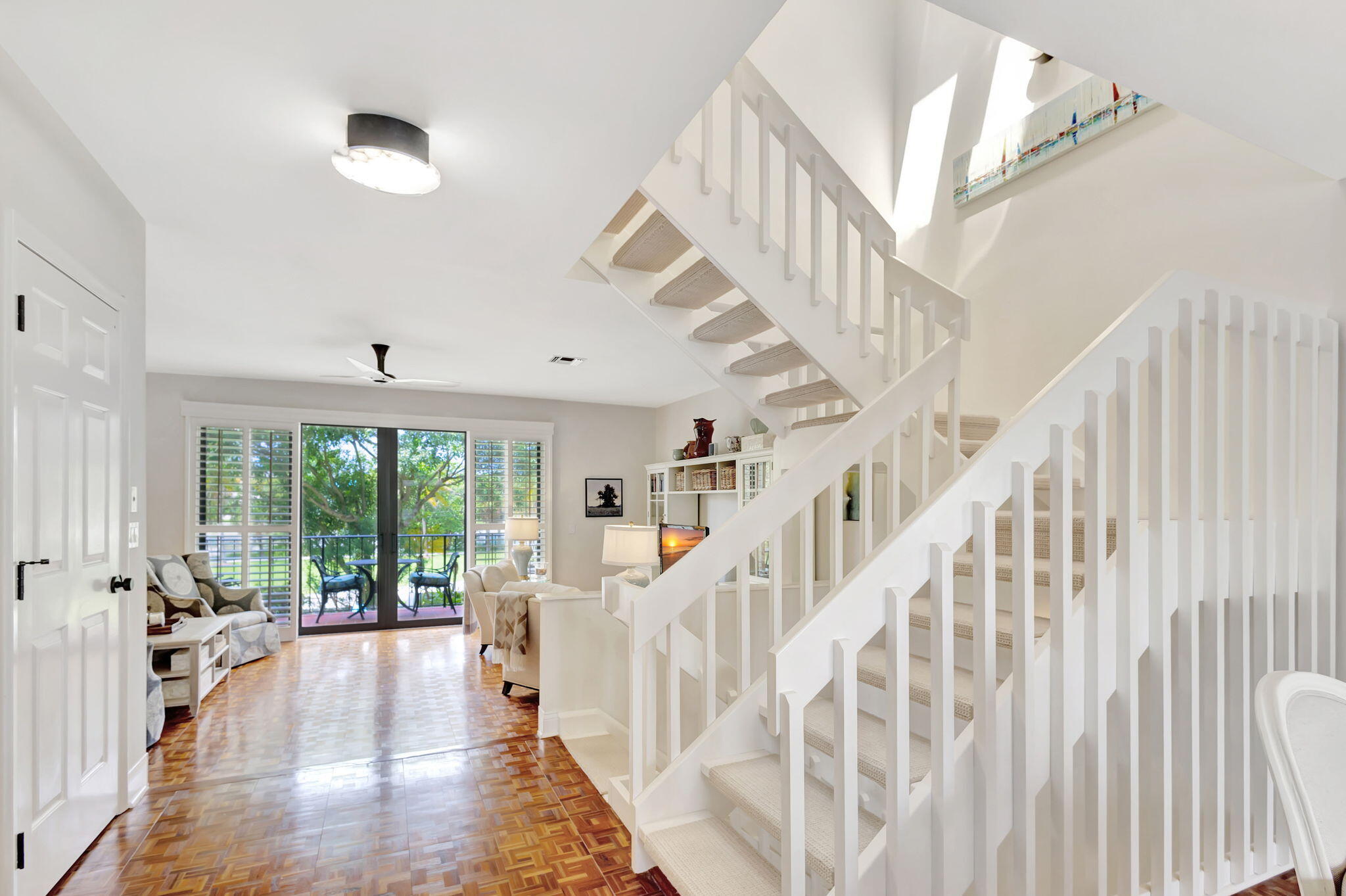 170 Celestial Way, Unit 83 Juno Beach, FL 33408 - Photo 14 of 70 a view of staircase with white walls and windows