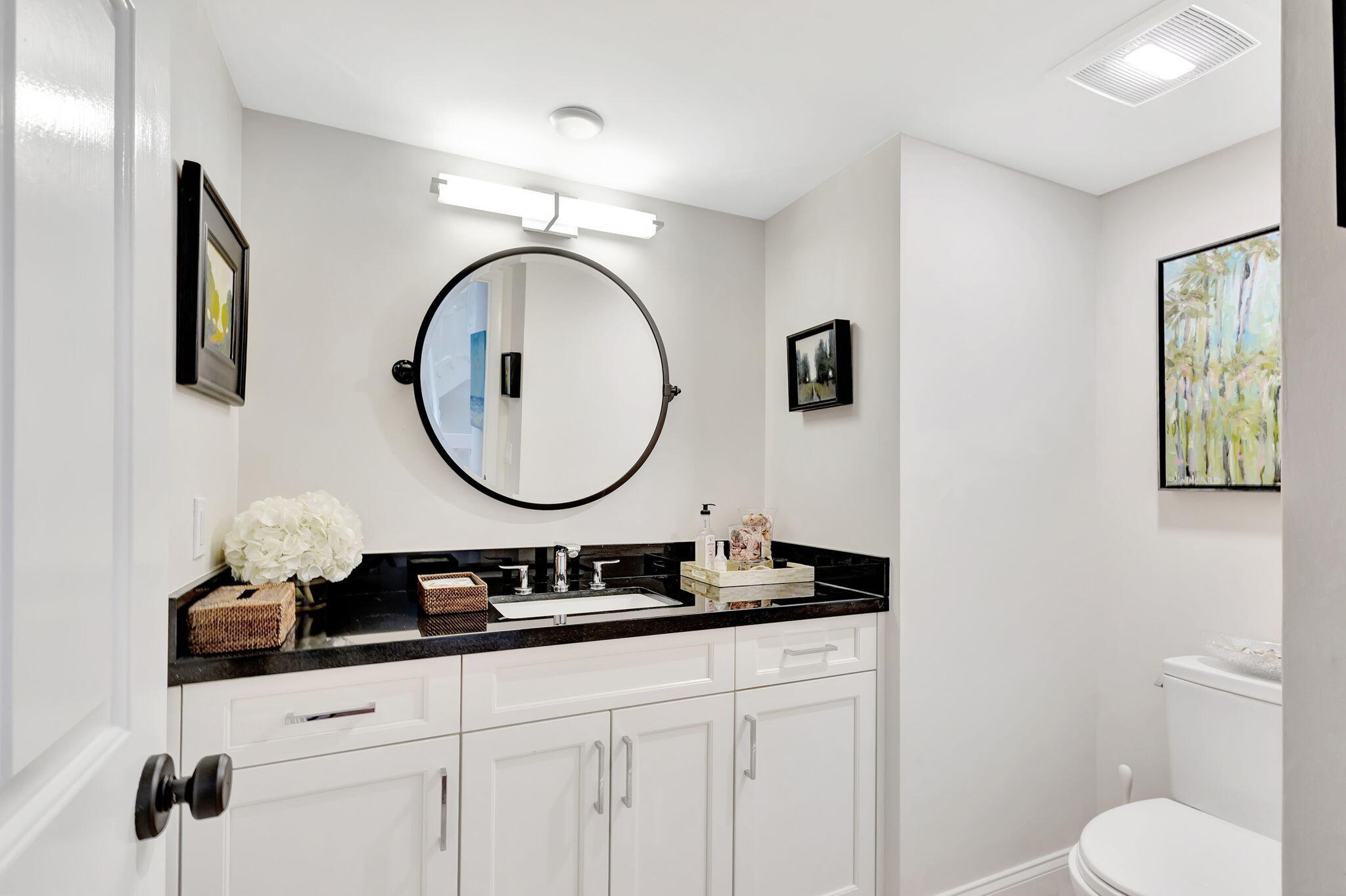 170 Celestial Way, Unit 83 Juno Beach, FL 33408 - Photo 26 of 70 a bathroom with a toilet a sink and a mirror