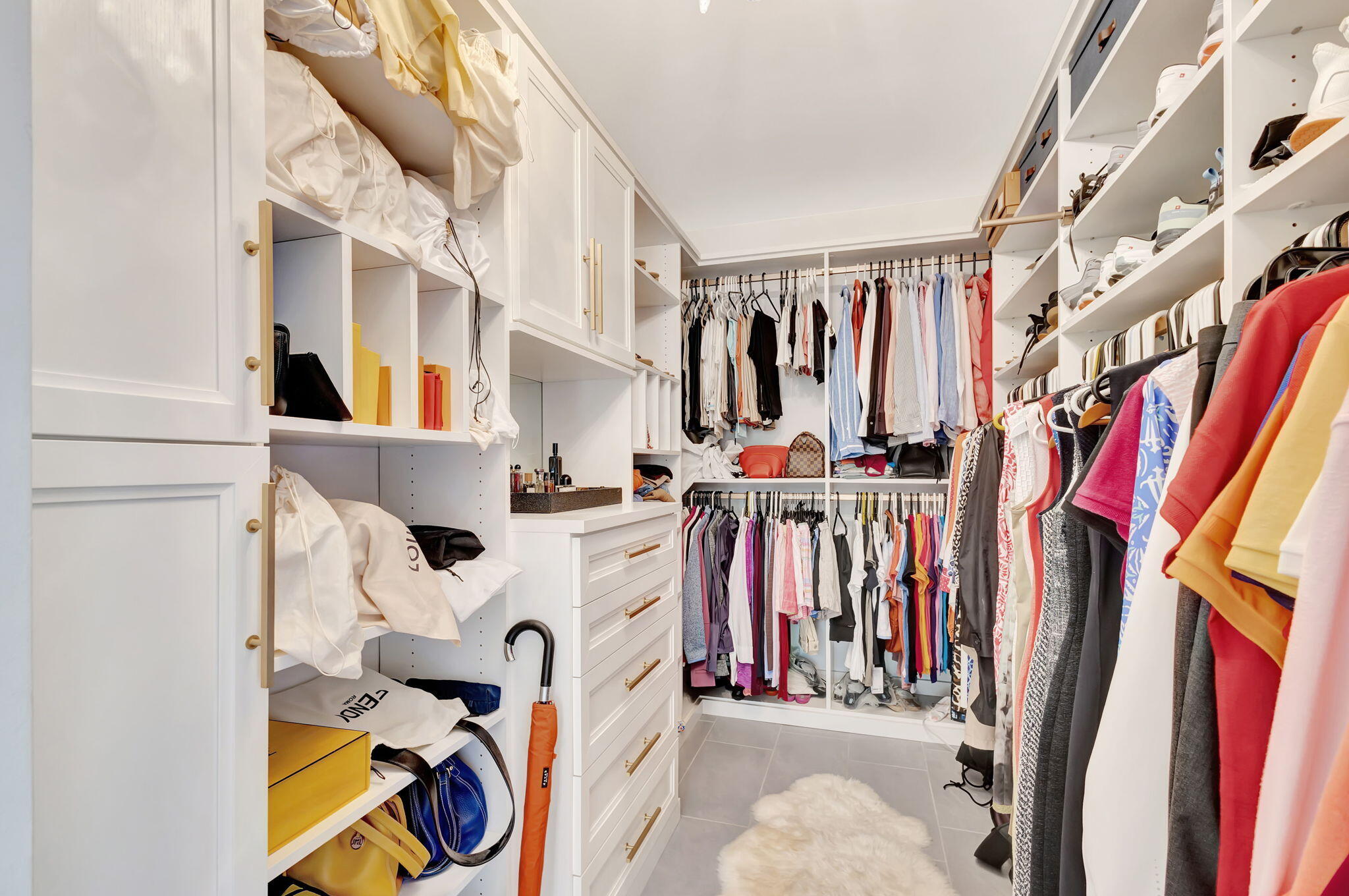 170 Celestial Way, Unit 83 Juno Beach, FL 33408 - Photo 31 of 70 a view of walk in closet with clothes and shoes