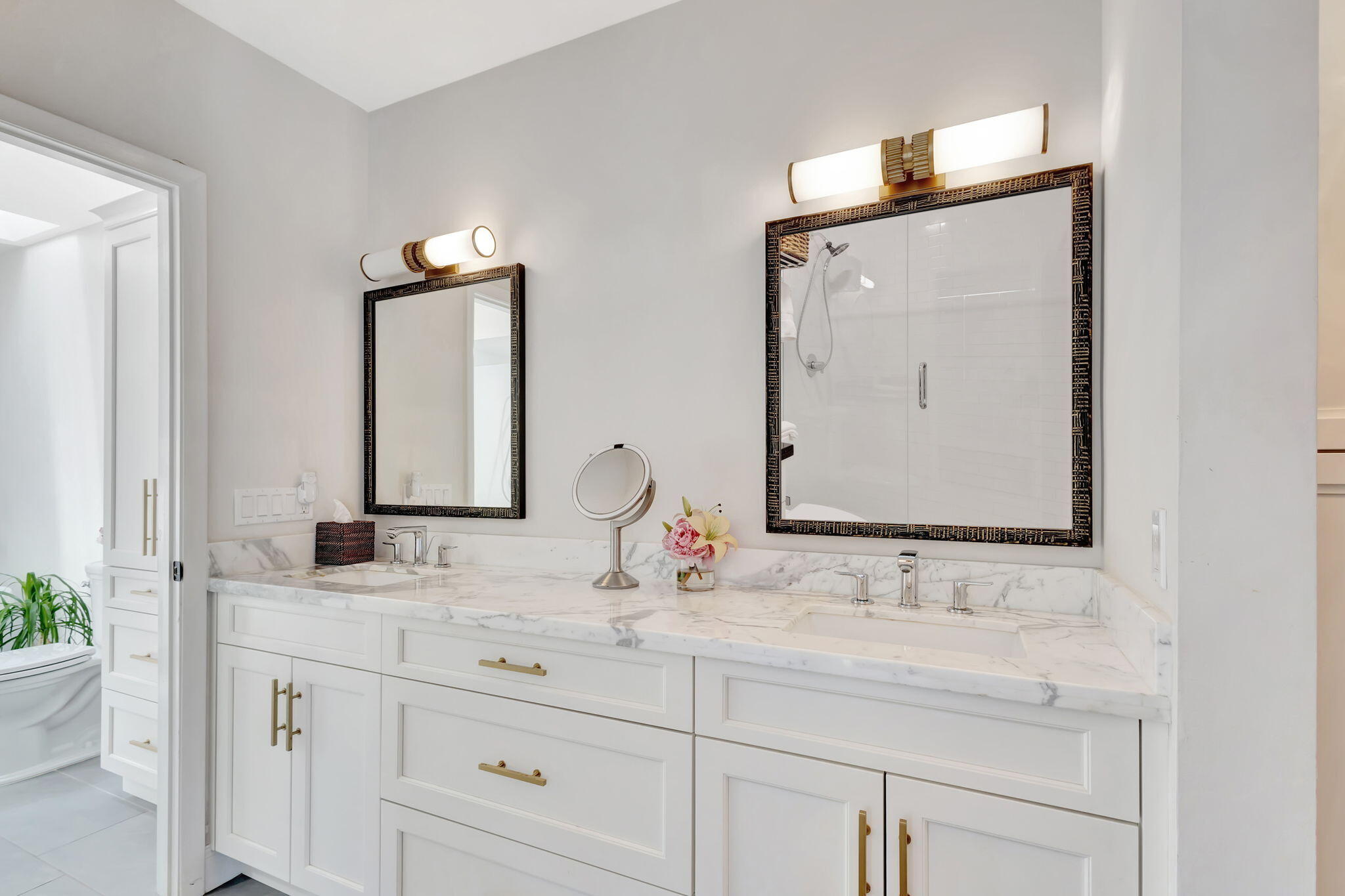 170 Celestial Way, Unit 83 Juno Beach, FL 33408 - Photo 32 of 70 a bathroom with double vanity sinks and a mirror