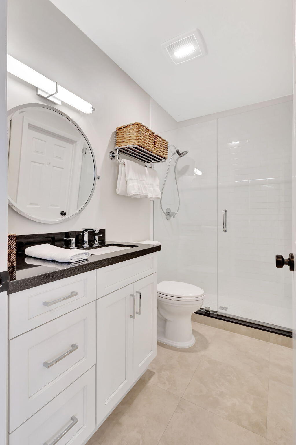 170 Celestial Way, Unit 83 Juno Beach, FL 33408 - Photo 39 of 70 a bathroom with a granite countertop sink mirror and toilet
