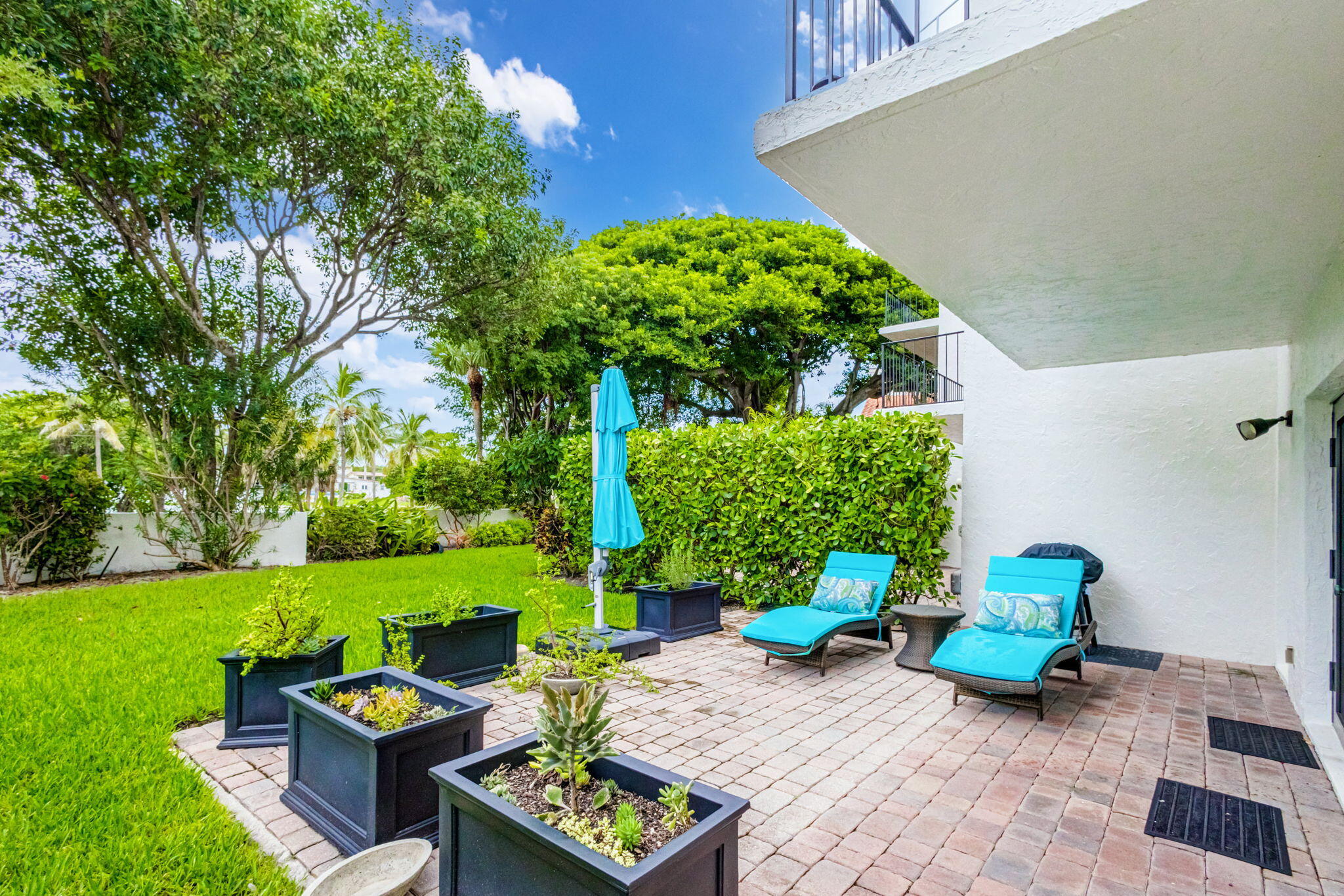 170 Celestial Way, Unit 83 Juno Beach, FL 33408 - Photo 51 of 70 a backyard of a house with seating space