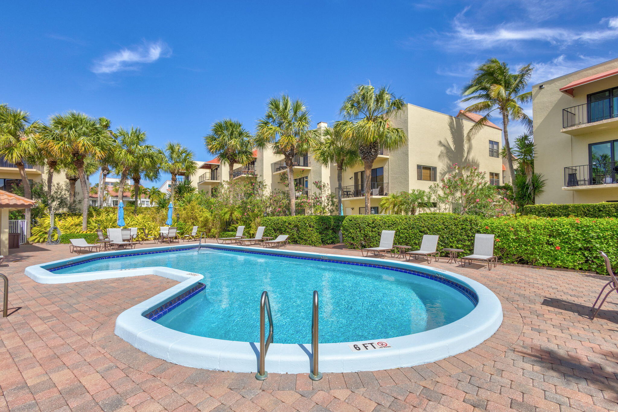 170 Celestial Way, Unit 83 Juno Beach, FL 33408 - Photo 58 of 70 a view of a swimming pool with a yard and plants
