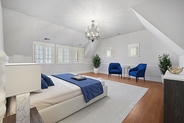 a bathroom with a granite countertop sink a mirror and a bathtub
