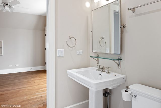 a bedroom with a large bed closet and window