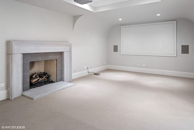 a view of an empty room and a window