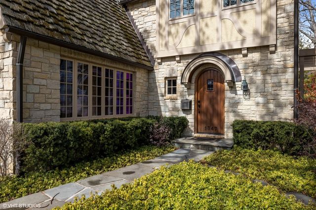 a picture of a bench in front of a wall