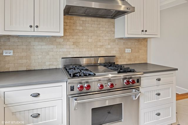 a view of a dining room with furniture wooden floor and chandelier