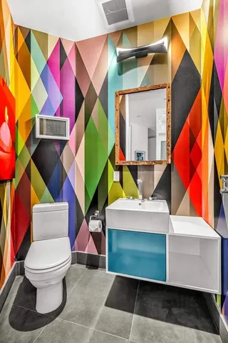 a bathroom with a toilet and a bathtub