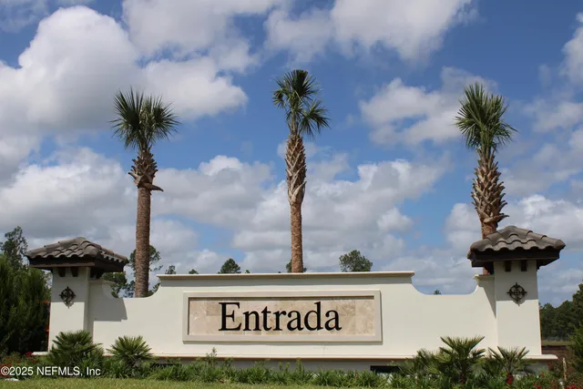 a close up of a sign board with potted plants