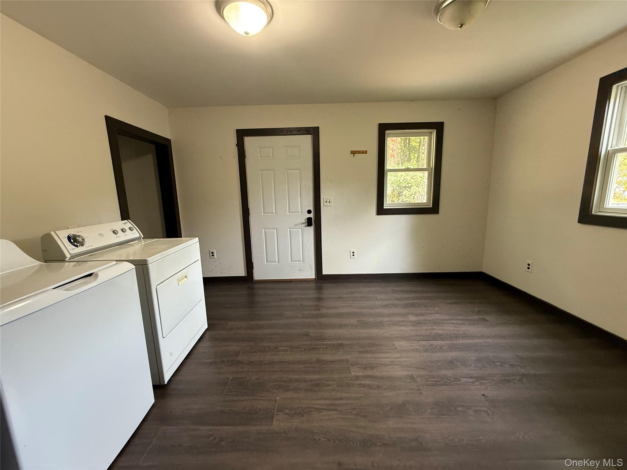 241 White Bridge Road Middletown, NY 10940 - Photo 8 of 29 Laundry area with dark wood finished floors and washer and dryer